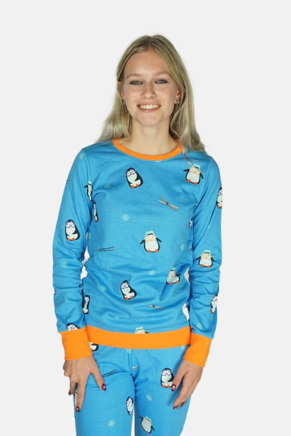 Pinguïn met skies. Voorzijde, blonde dame.